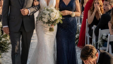 At my lavish wedding, I found my parents sitting on folding chairs near the kitchen, far away from all the important guests. Just minutes before I walked down the aisle, I discovered that my future mother-in-law had tricked my father into handing over his entire life savings to pay for the wedding—all while proudly claiming she was our “generous sponsor.” My fiancé already knew the truth. He didn’t care at all. So I grabbed the microphone… and he still didn’t care. Then I walked down the aisle, took the microphone again, and made sure all 200 guests saw exactly who they really were.